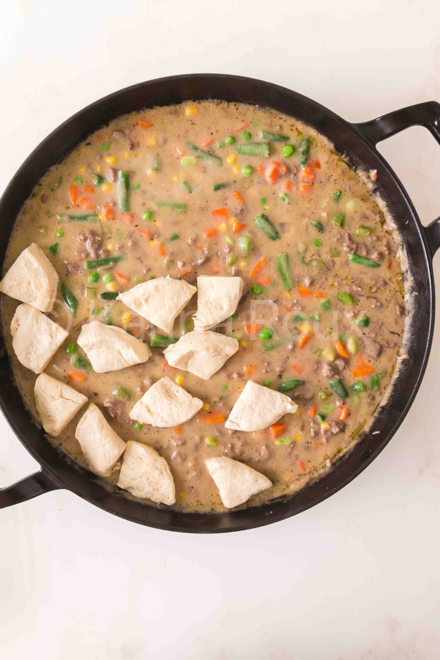 Ground beef pot pie with biscuits