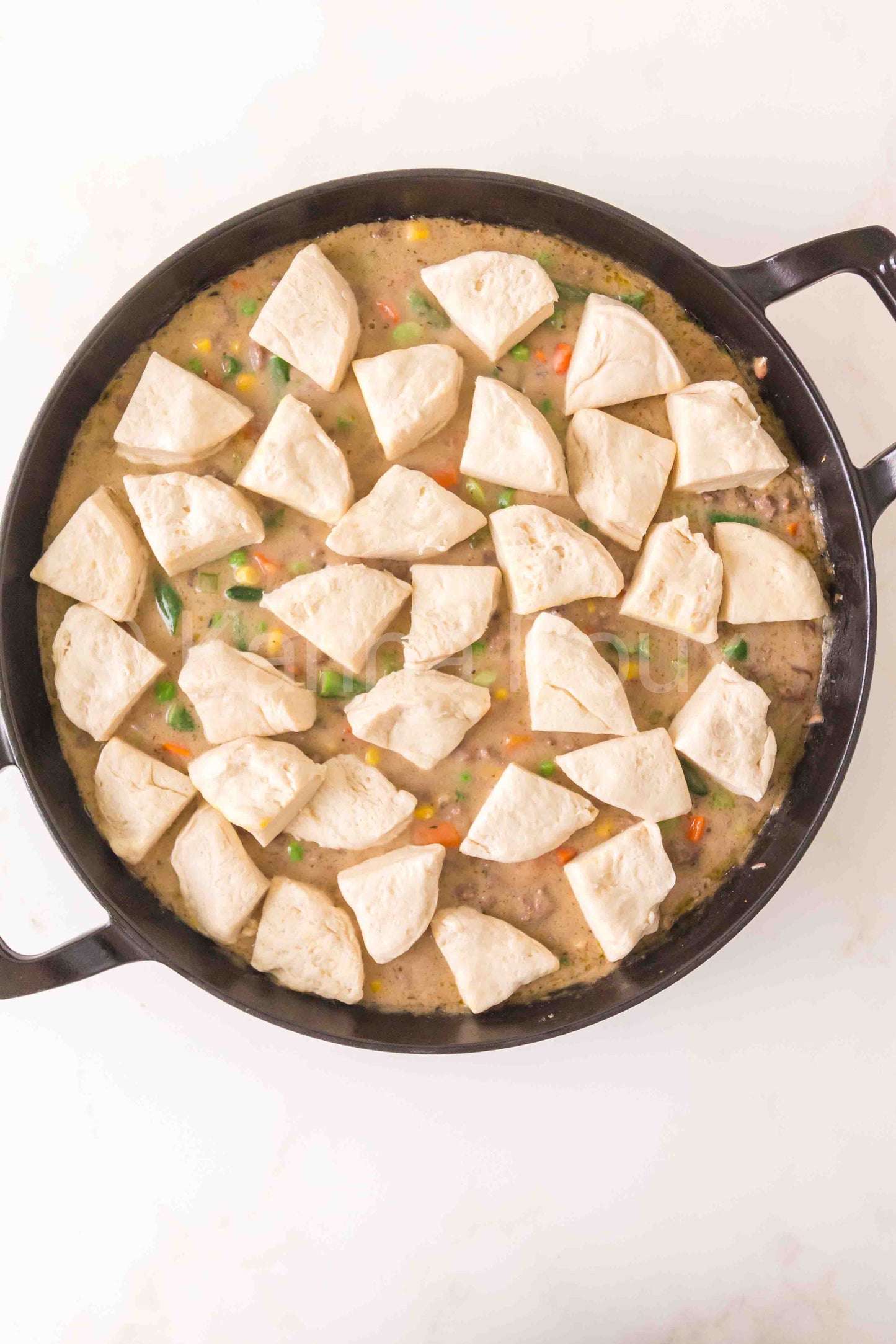 Ground beef pot pie with biscuits