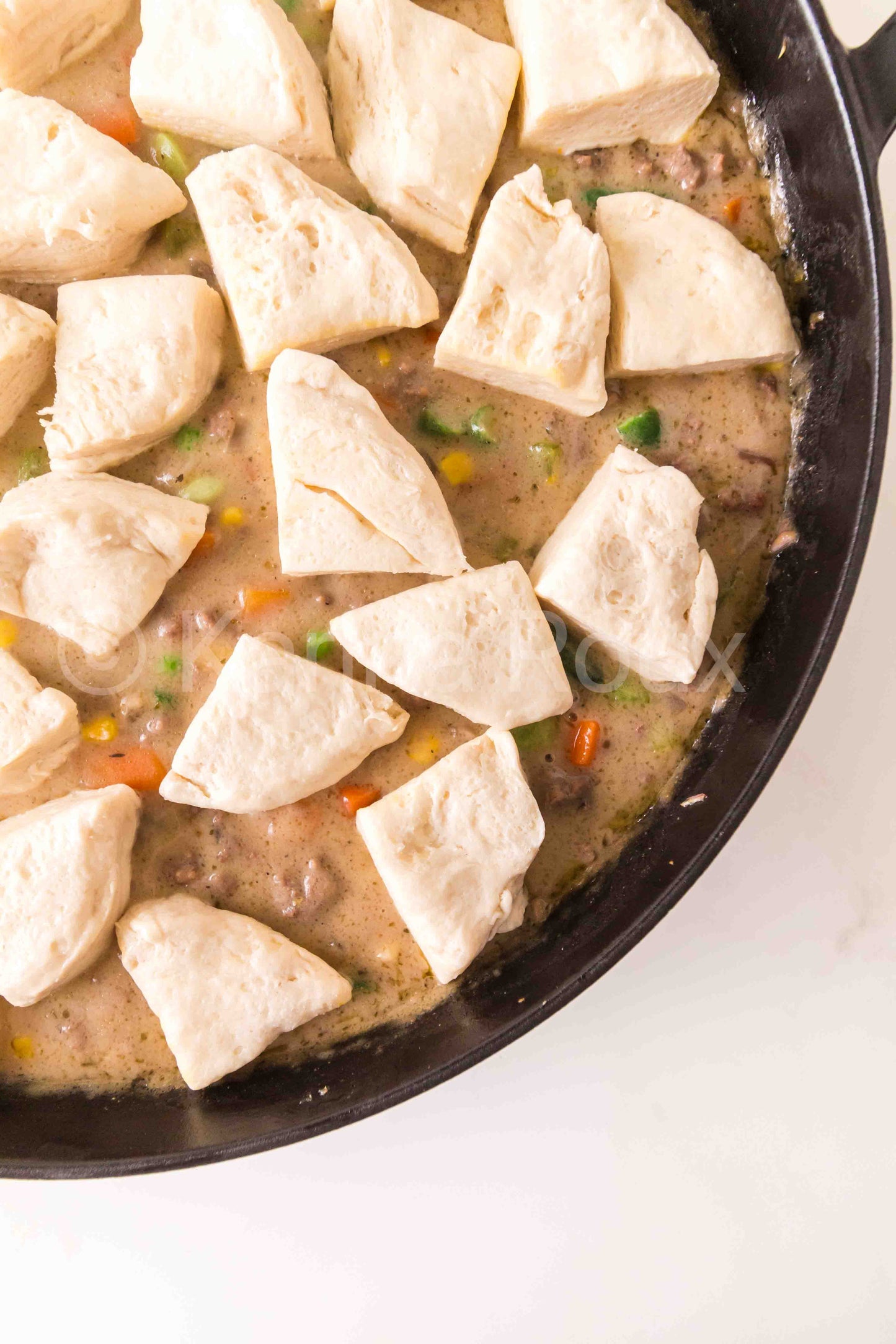 Ground beef pot pie with biscuits