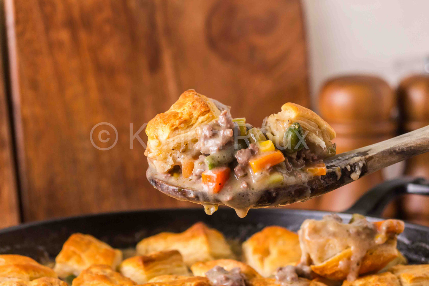 Ground beef pot pie with biscuits