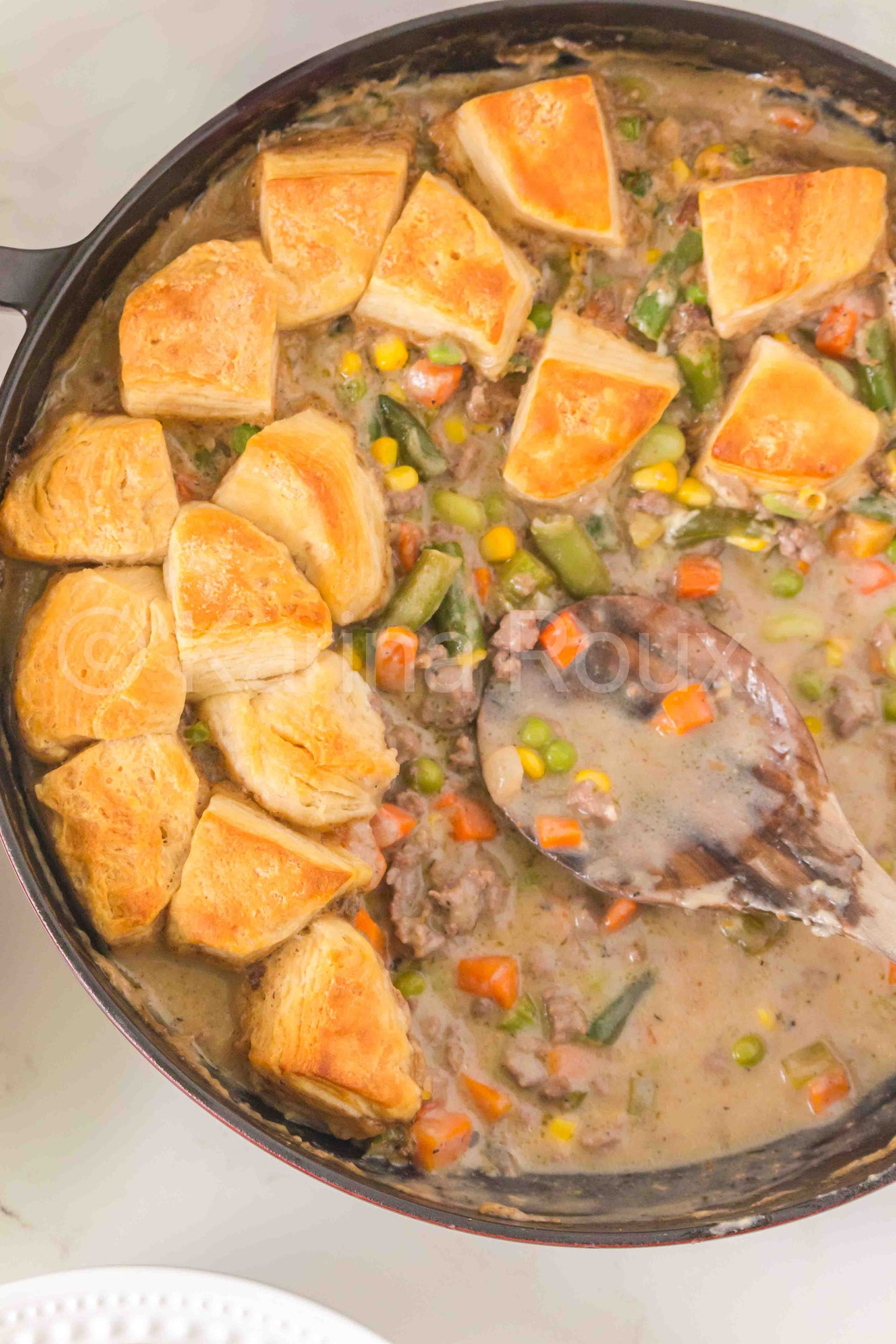 Ground beef pot pie with biscuits