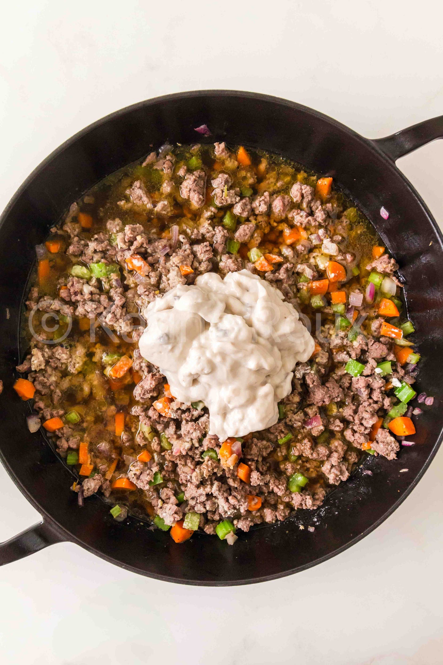Ground beef pot pie with biscuits