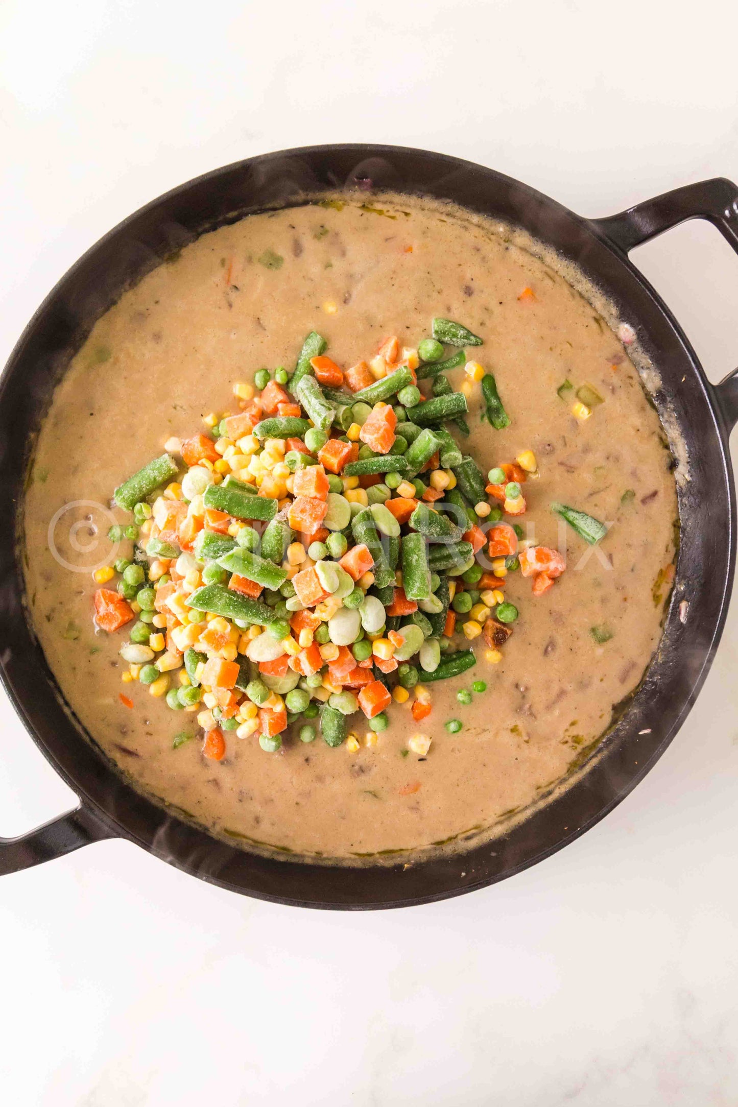 Ground beef pot pie with biscuits